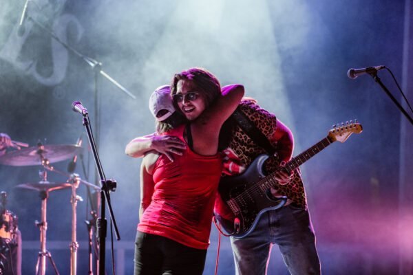 The Rick Lewis Band sharing a moment on stage